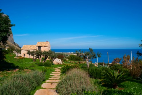  THE VILLA WITH ITS BEAUTIFUL PANORAMA AND A PART OF THE GARDEN